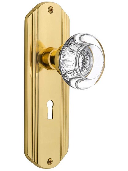 Streamline Moderne Mortise Lock Set with Round Crystal Glass Knobs with Keyhole in Polished Brass.